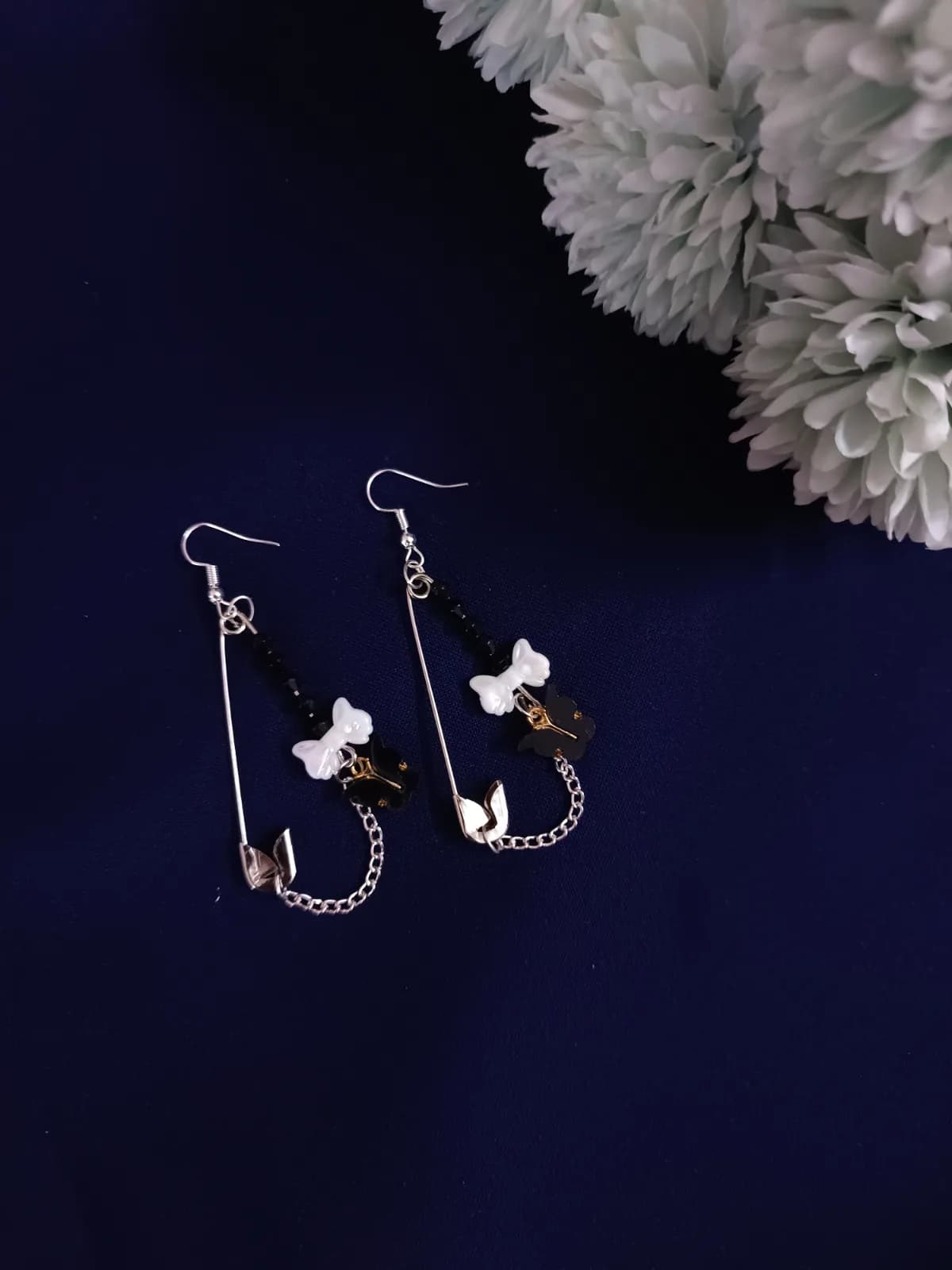 Safety pin earrings: All That Flies Away